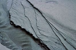 A close up of the sand on the beach