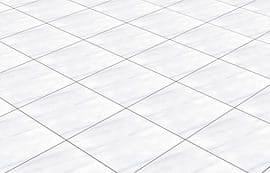 A white tile floor with no grout.