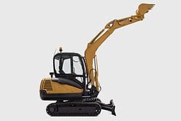 A yellow and black excavator is parked on the ground