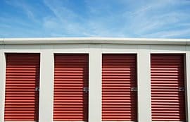 A row of red and white storage units.